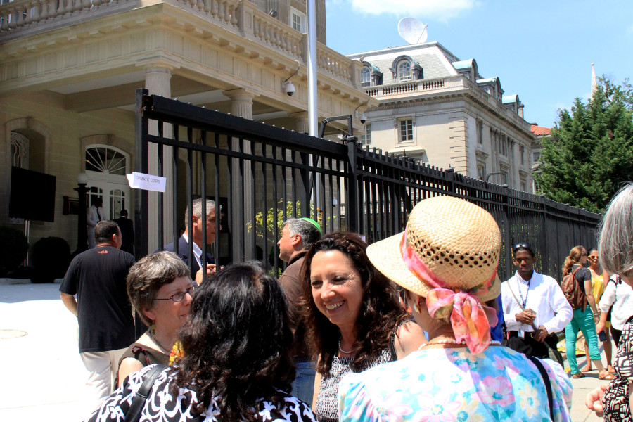 A crowd stands near the Cuban Embassy's front gates in Washington on July 20, 2015. (Jennifer-Leigh Oprihory/MEDILL NSJI)
