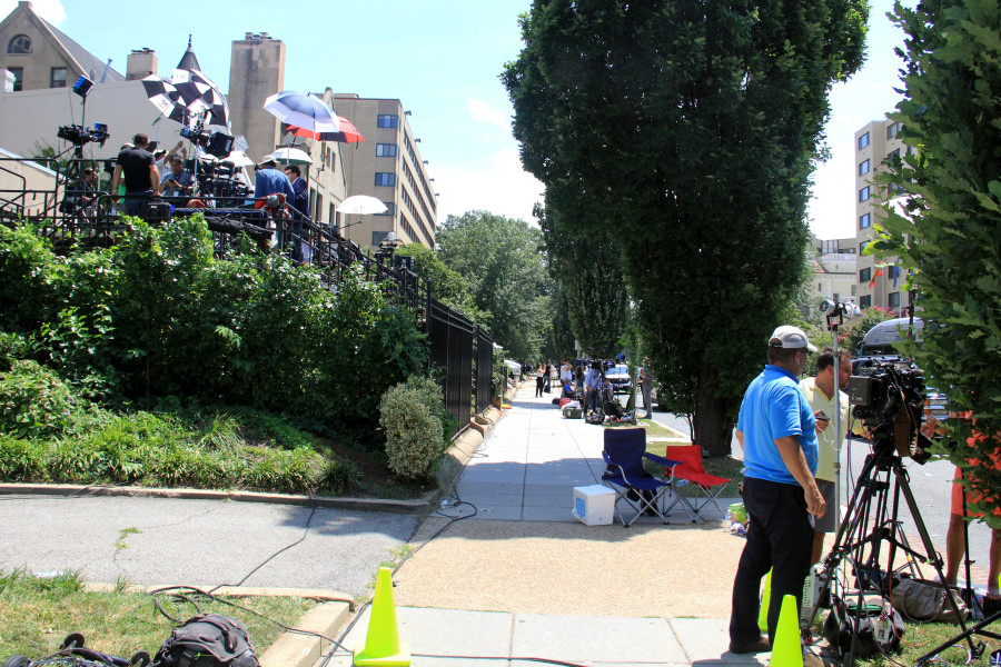 Broadcast media camp out on risers across the street from the Cuban Embassy in Washington on July 20, 2015. (Jennifer-Leigh Oprihory/MEDILL NSJI)
