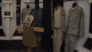 Tammy Thueringer/MEDILL Four service uniforms show what members of the military wear. Army (far left), Navy (second to left), Marine Corps combat uniform (second to right) and Air Force (right). “Up front is a battle cross with a flack jacket with a bullet proof vest, boonie cap and magazine pouches," Adams said. “It’s there to show what some actually carried into combat that protected us from shrapnel and bullets.”