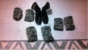 Elbow pads and pair of boots purchased from a soldier at Fort Leonard Wood Army base in Missouri, destined for the battlefields of Ukraine. (Photo taken Feb. 8 by Bob, a Ukrainian man who purchases and ships the items to Ukraine.)  