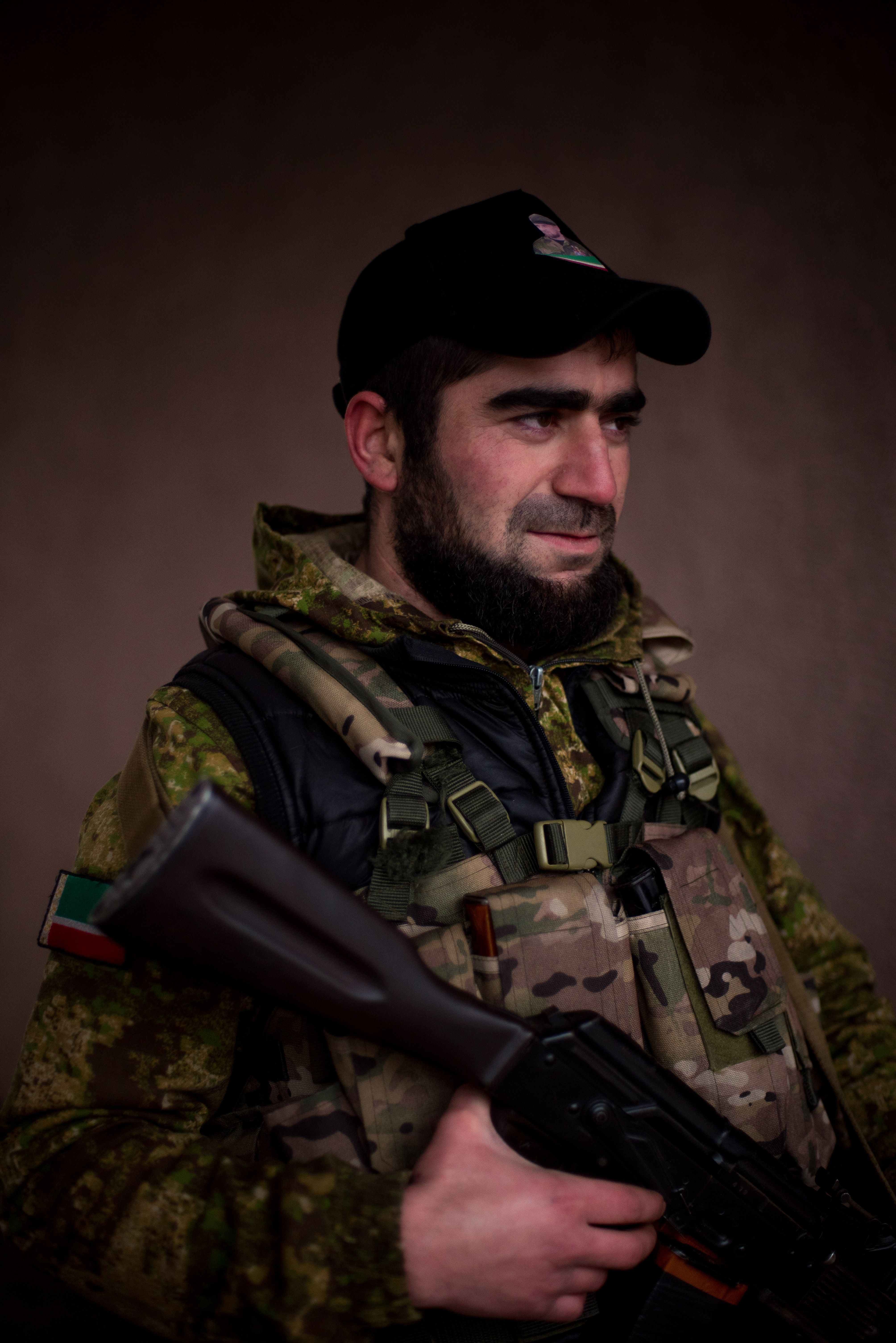 1/26: A Chechen fighter in pro-Russian separatist held Gorlovka. Note the Chechnya flag on his arm and picture on the baseball cap of the Head of the Chechen Republic, Ramzan Kadyrov. (Photo Credit: James Sprankle)