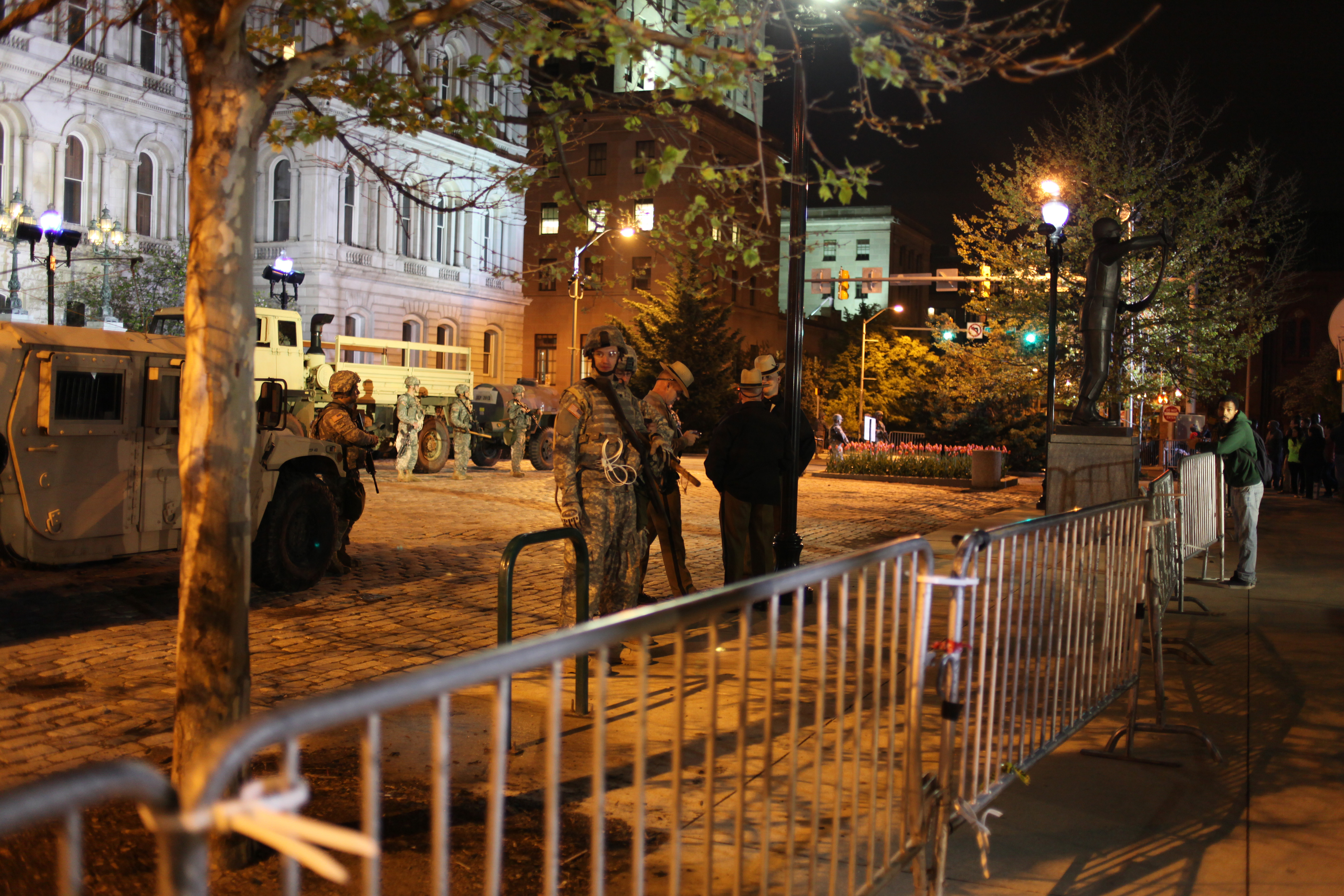Maryland Army National Guard soldiers converse behind a barricade in front of Baltimore City Hall on April 30, 2015. (Jennifer-Leigh Oprihory/MEDILL NSJI)