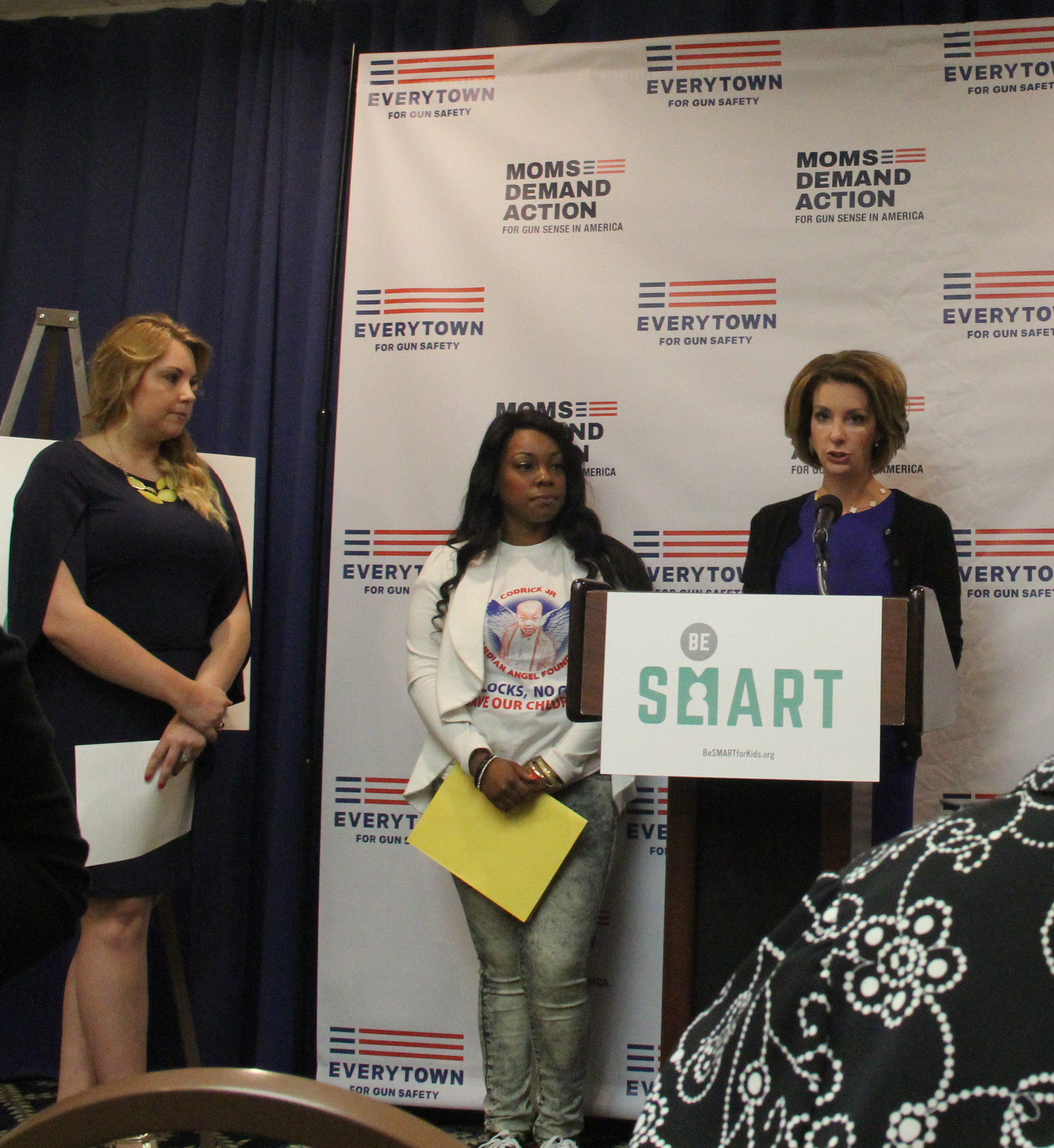 Shannon Watts, the founder of Moms Demand Action for Gun Sense in America, speaks at a conference in Washington D.C. on May 4, 2015, while speakers Ashley Beal (center) and Misty Uribe (left) look on. (Yinmeng Liu/MEDILL NSJI)